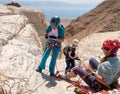 Experienced athletes start the descent with the equipment for snapping in the mountains of the Judean Desert near the Tamarim