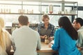 Experienced smiling barista giving master class Royalty Free Stock Photo