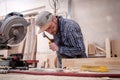 Experienced carpenter work with wooden Royalty Free Stock Photo