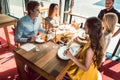 Experienced chef congratulated by four people at a trendy exclusive restaurant Royalty Free Stock Photo