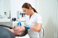 Experienced cosmetologist uses the non-surgical microdermabrasion method