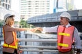 Experienced entrepreneurs, 2 engineers man and woman Used hand for fist bump