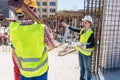 Experienced female foreman coordinating and guiding workers Royalty Free Stock Photo