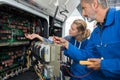Experienced female mechanic checking engine bus Royalty Free Stock Photo