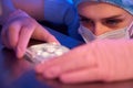 Experienced female researcher preparing samples for storage