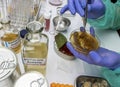Experienced laboratory scientist analyzing a sample from a canned food can, botulism infection in sick people
