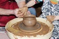 experienced master potter teaches the art of making pots clay on the's wheel