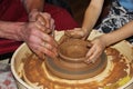 experienced master potter teaches the art of making pots clay on the 's wheel