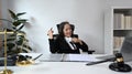 Experienced mature female lawyer sitting in her personal office and watching online webinar on laptop computer Royalty Free Stock Photo