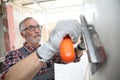 Experienced plasterer working on new construction wall Royalty Free Stock Photo