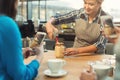 Experienced smiling barista giving master class at coffee shop interior Royalty Free Stock Photo