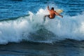 Experienced surfer rides ocean wave