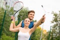 Experienced tennis player training lady Royalty Free Stock Photo