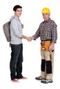 Experienced tradesman meeting new apprentice Royalty Free Stock Photo