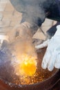 An experienced welder at work. Preparation and welding process of cast iron furnace. Selection focus. Shallow depth of field Royalty Free Stock Photo