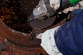 An experienced welder at work. Preparation and welding process of cast iron furnace. Selection focus. Shallow depth of field Royalty Free Stock Photo
