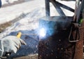 An experienced welder at work. Preparation and welding process of cast iron furnace. Selection focus. Shallow depth of field Royalty Free Stock Photo