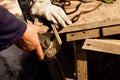 An experienced welder at work. Preparation and welding process of cast iron furnace. Selection focus. Shallow depth of field. Royalty Free Stock Photo