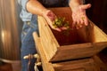 Experienced winemaker separating grape solids from the juice