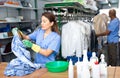 Experienced woman working in dry cleaner