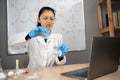 Experiments in a chemistry lab. E-learning. College professor teaching chemistry on web, conducting online class from Royalty Free Stock Photo