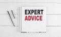EXPERT ADVICE text written on notebook on the wooden background Royalty Free Stock Photo