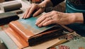 Expert craftsman holding handmade leather book in close up workshop generated by AI