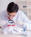 Expert criminologist working in the lab for evidence Royalty Free Stock Photo