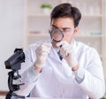 Expert criminologist working in the lab for evidence Royalty Free Stock Photo