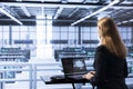 IT expert in data center updating AI systems, writing intricate binary code