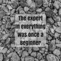 The expert in everything was once a beginner on abstract stones background. Royalty Free Stock Photo