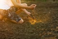 Expert farmer pouring soil to hand at garden