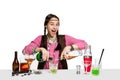 Expert female barman is making cocktail at studio Royalty Free Stock Photo