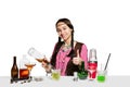 Expert female barman is making cocktail at studio Royalty Free Stock Photo