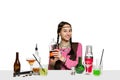 Expert female barman is making cocktail at studio Royalty Free Stock Photo