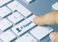 IT Expert - Inscription on Blue Keyboard