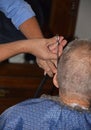 Expert Men& x27;s Hair dresser shows skill cutting hair with scissor and comb