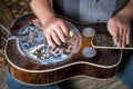 Expert musicition plays steel guitar