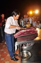 An expert is performing tuna fillet techniques at Vietnam seafood festival in Tuy Hoa city