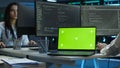 Expert in server room coding on chroma key notebook Royalty Free Stock Photo