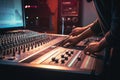 Expert sound engineer adjusts mixer knobs .generated by AI Royalty Free Stock Photo