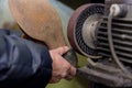 An expert who repairs shoes in his workshop is taking care of his shoes in his workshop Royalty Free Stock Photo