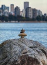 Expertly balanced stones on a Vancouver shoreline at sunset Royalty Free Stock Photo