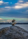 Expertly balanced stones on a Vancouver shoreline at sunset Royalty Free Stock Photo