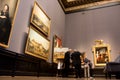 Experts in the gallery of the art Museum Royalty Free Stock Photo