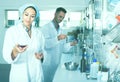 Experts making tests in winery laboratory