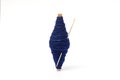 Natural line of cotton thread wrap on small wooden core with needle