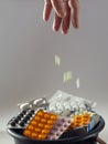 Expired medicines are in the bin. Vertical medicinal background