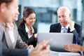 Explaining the business plan in detail. Attractive businesswoman showing her corporate senior something on a laptop Royalty Free Stock Photo