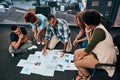 Explaining in detail. a group of focussed young coworkers working together and brainstorming while being seated on the Royalty Free Stock Photo